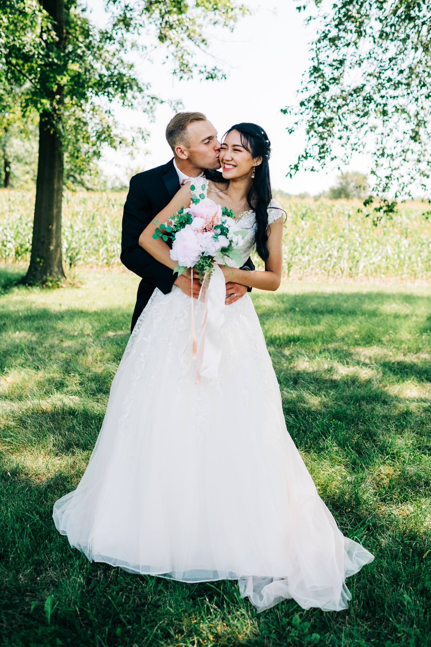 Bride in a lace beaded ballgown from David’s Bridal