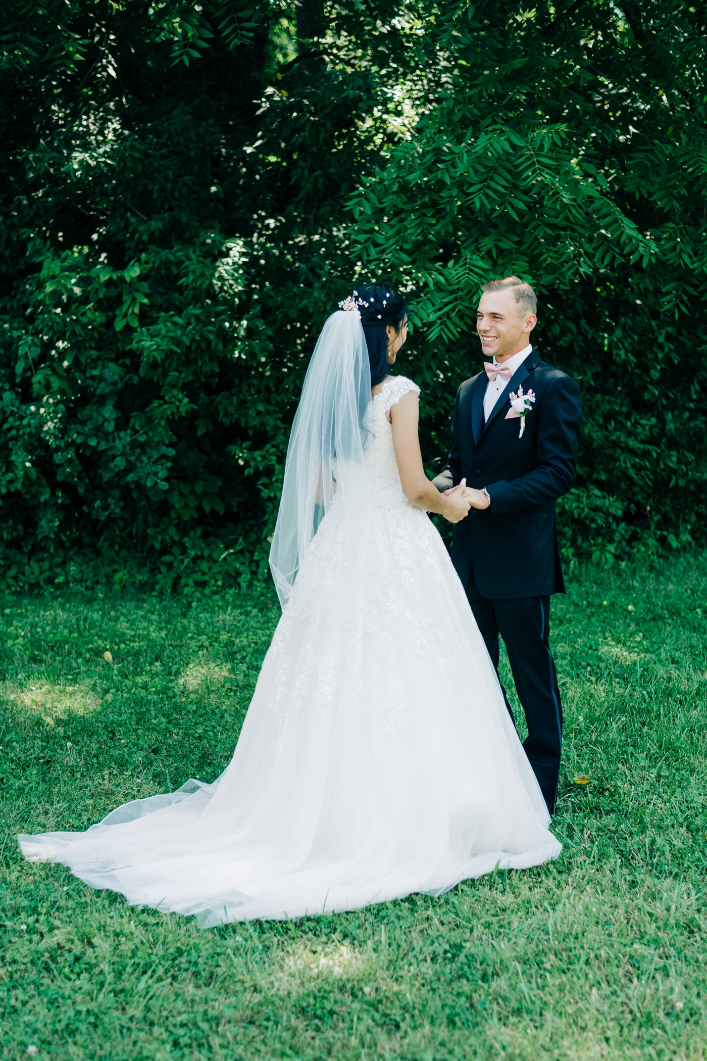 Bride in a lace beaded ballgown from David’s Bridal