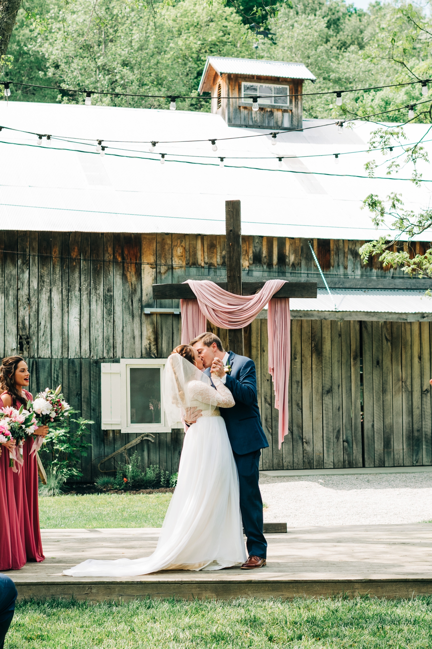 First kiss at the outdoor ceremony at The Old Barn at Brown County