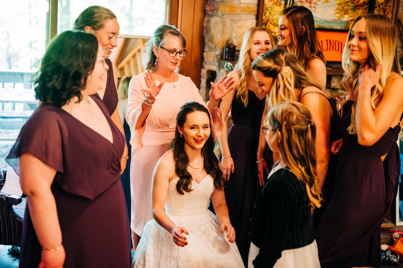Bridesmaids in wine colored gowns from Azazie 