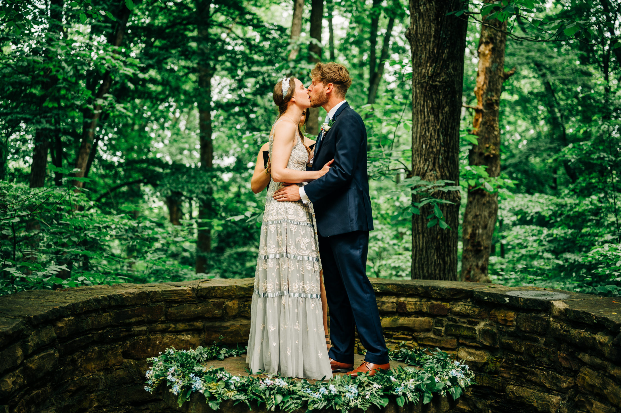 Bride and groom first kiss at wedding ceremony at Brown County State Park