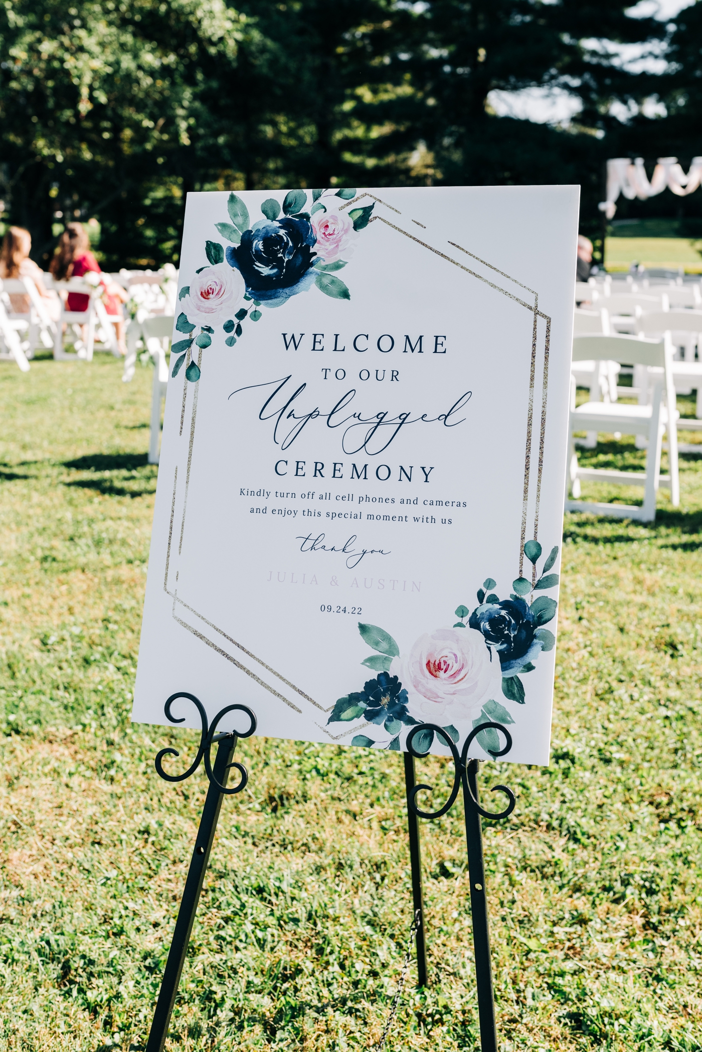 Wedding welcome signage at backyard wedding ceremony