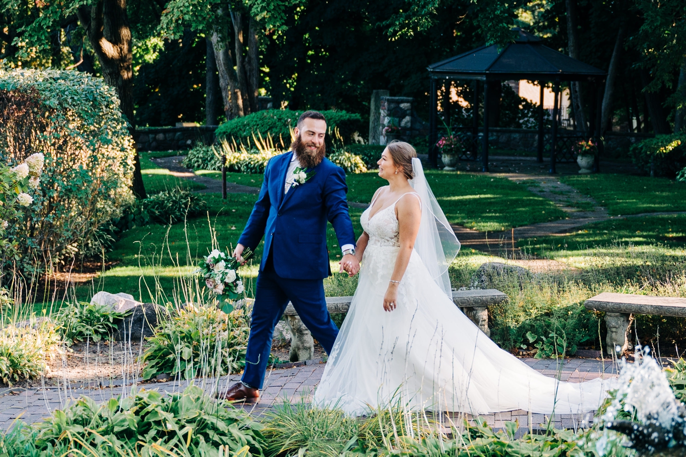 Bride and groom outdoor wedding portraits at Pine Knob Carriage House