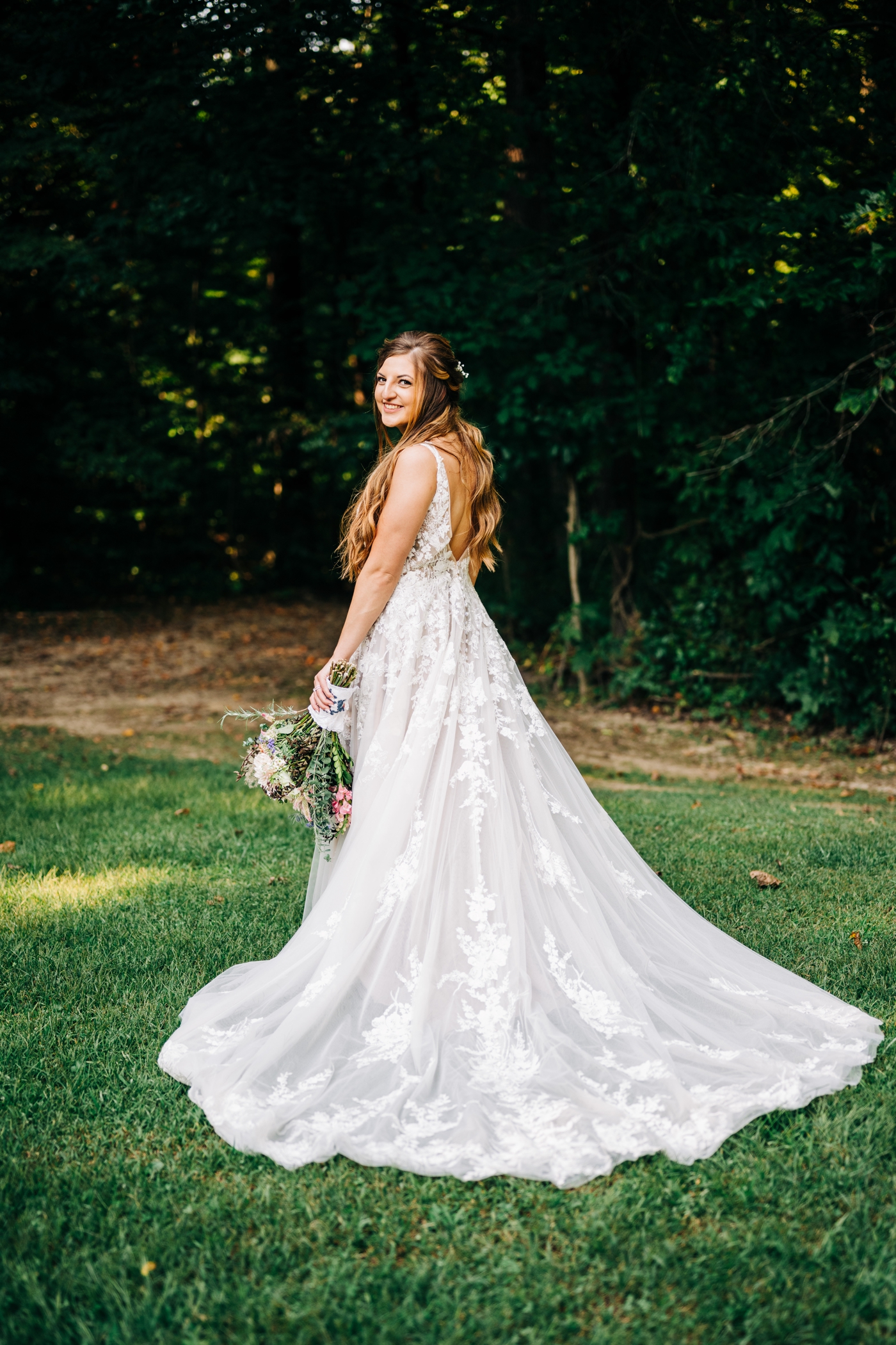 Bride wearing a-line wedding gown with lace details