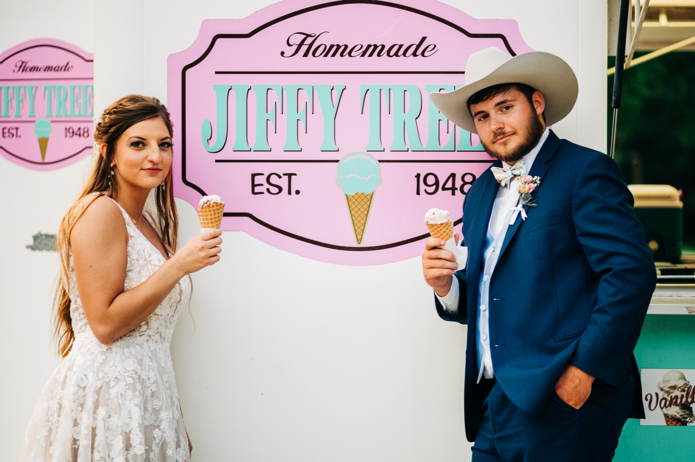 Bride and groom enjoying ice cream from their ice cream truck at their wedding reception