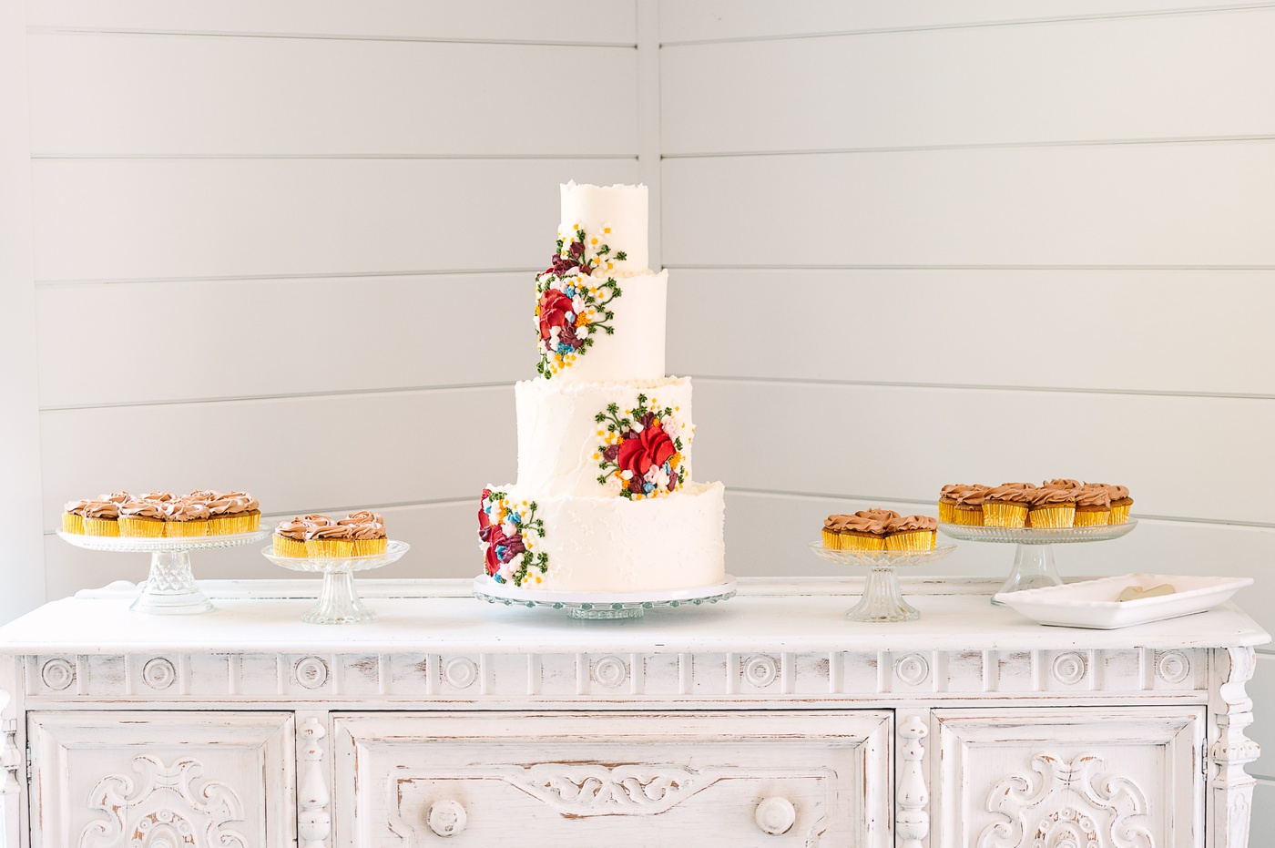 Wildflower wedding cake with frosting flowers by Farmhouse Cakes