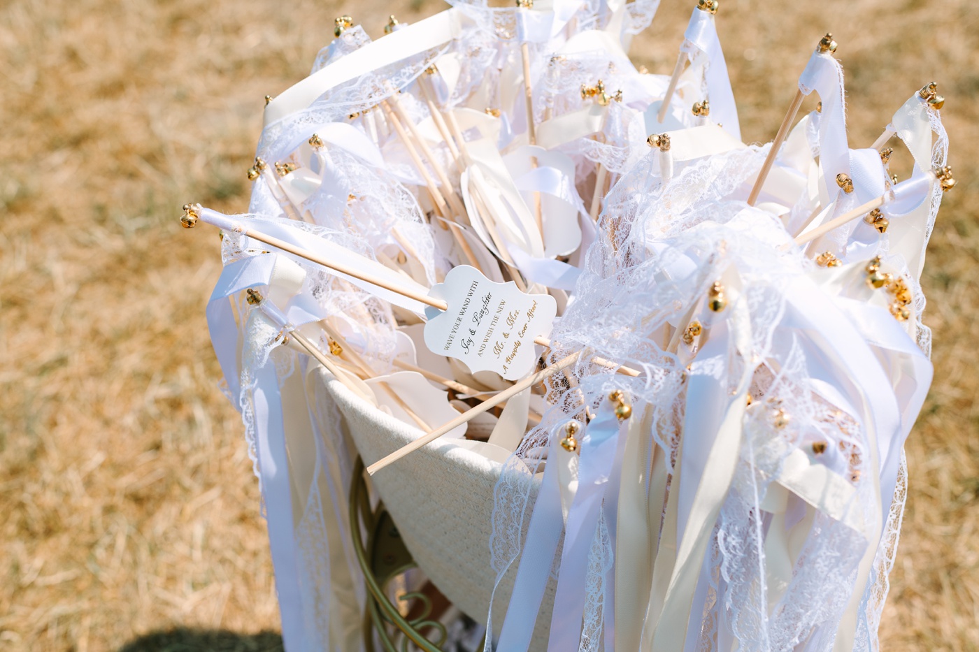 Basket with ribbon wands at a wedding ceremony