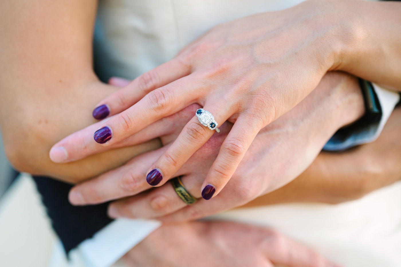 Three-stone diamond and amethyst engagement ring