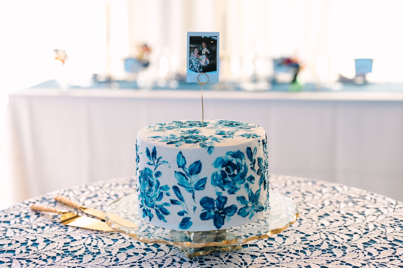 Single-layer cake with painted blue flowers for a Bloomington wedding