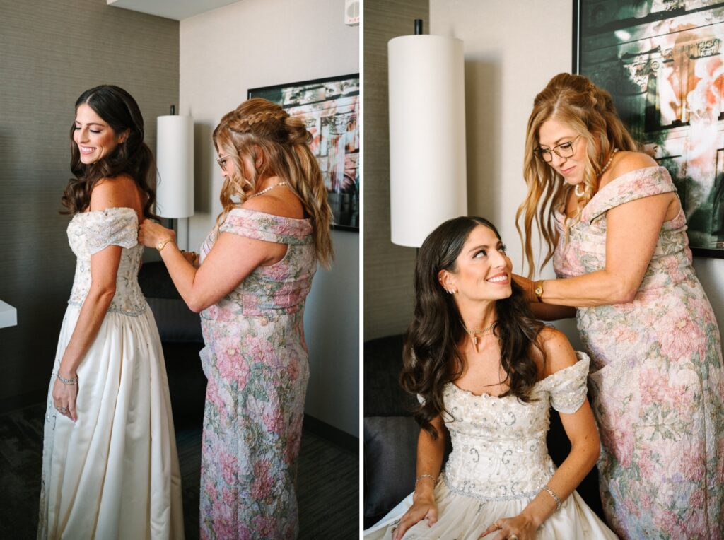 mother helping her daughter put on her antique wedding dress