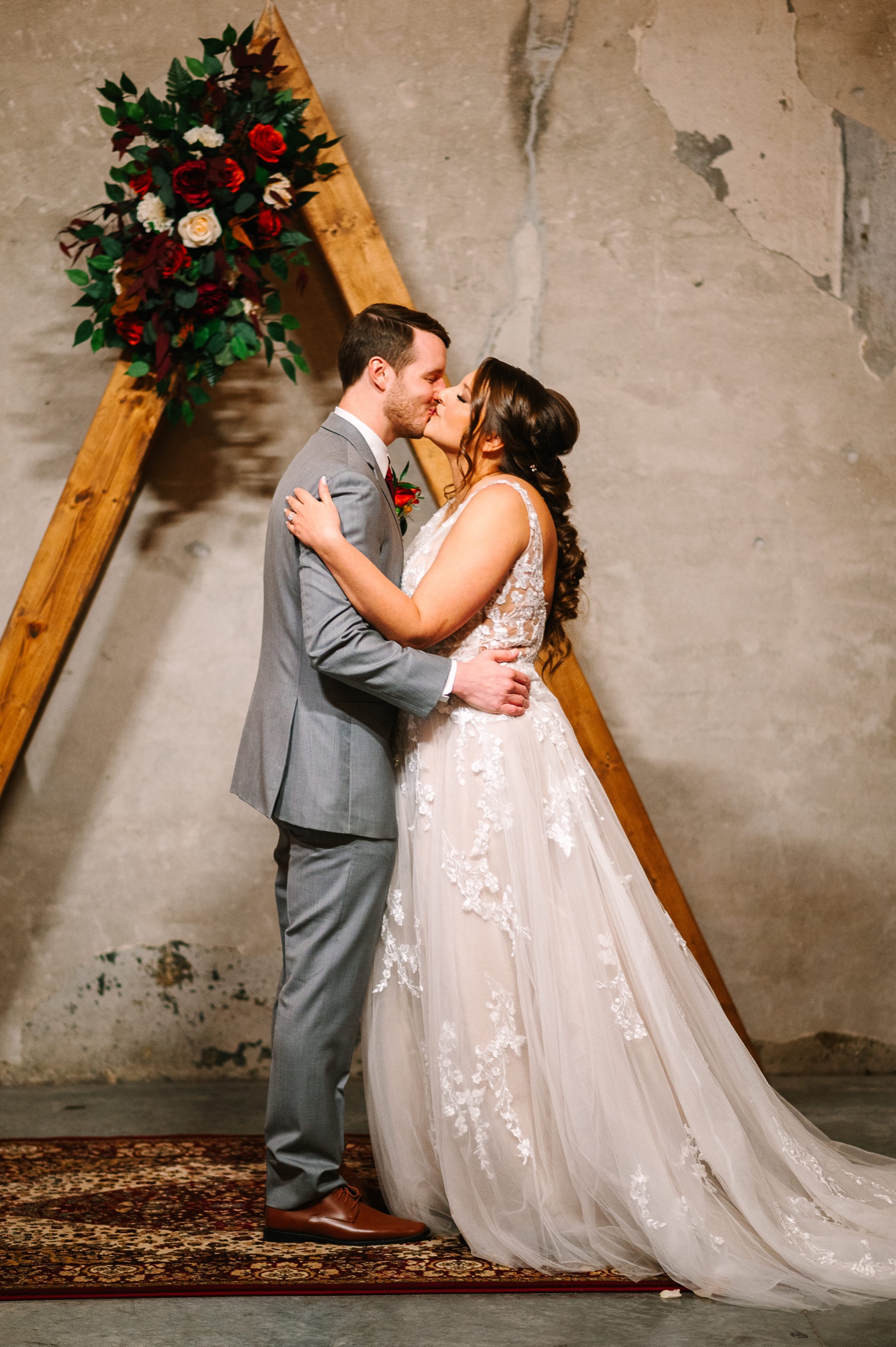 Bride and groom kissing at their Indianapolis wedding ceremony
