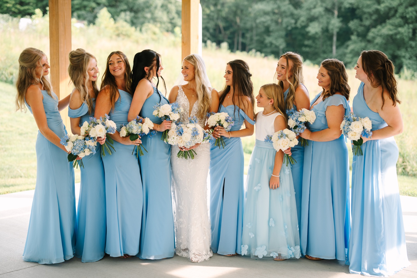 Bridesmaids wearing light blue dresses for a summer wedding